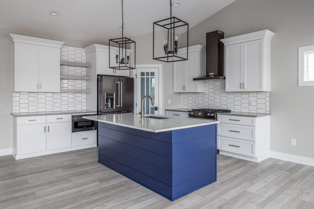 Modern custom kitchen featuring an open-concept layout with bold cabinetry, luxury finishes, and integrated smart technology.