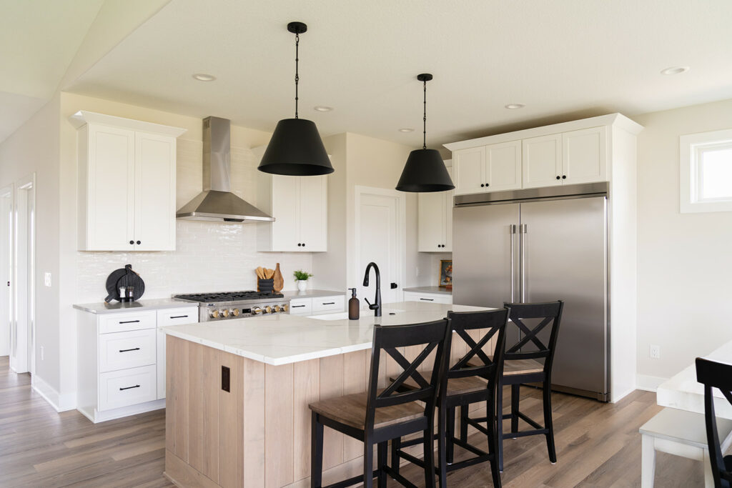an example of Metals: Striking the Right Balance in a kitchen by KRM custom homes.