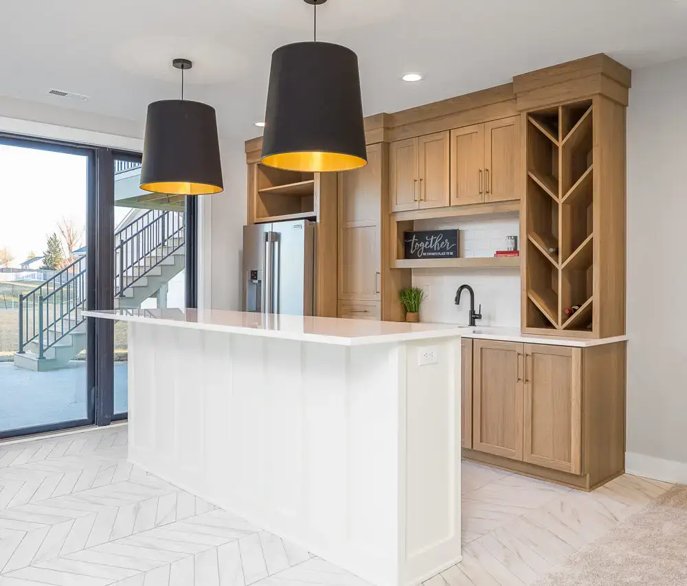 A kitchen featuring a tall, slanted wine shelf